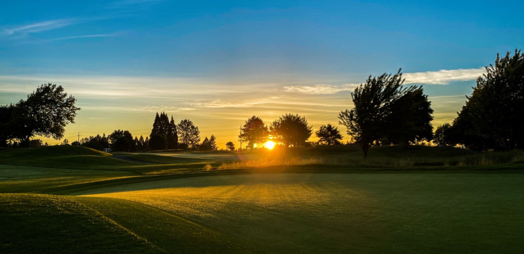 View of golf course at sunset
